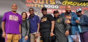 Cleveland organizers and elected officials in front of the Boots on the Ground With 1000 Black Men banner