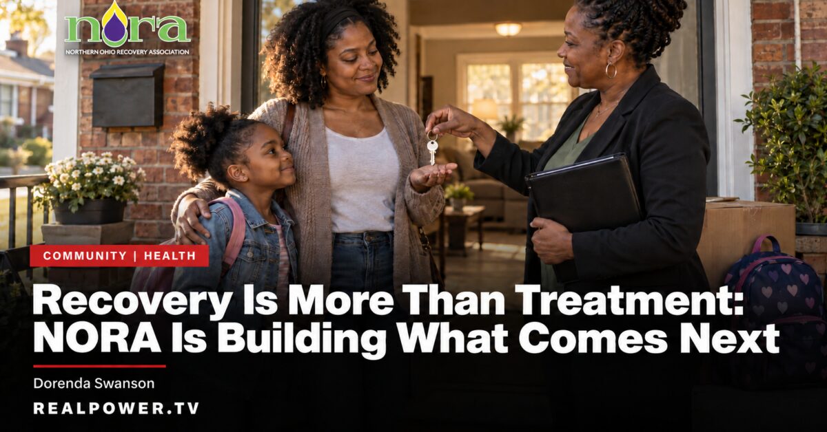A NORA staff member hands house keys to a mother standing with her daughter on a front porch.