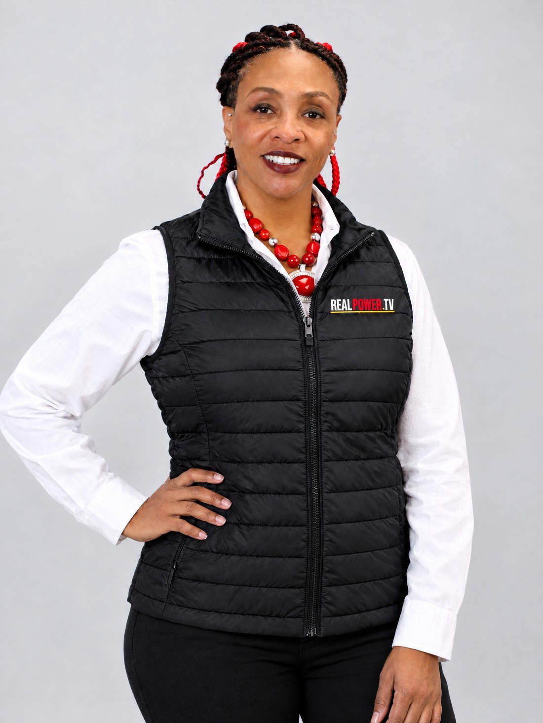 Dr. Heather E. Burton wearing The Authority Puffer Vest